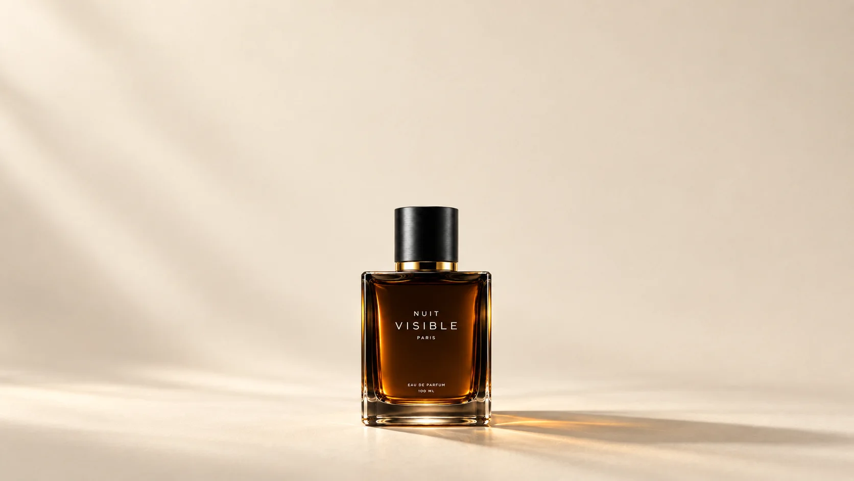 The NUIT VISIBLE flacon, small, on a cream surface in soft window light